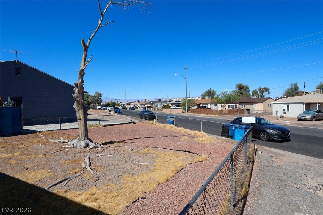 123 W Victory Road, Henderson, NV 89015 A spacious front yard sits nestled within a quiet, established neighborhood setting.