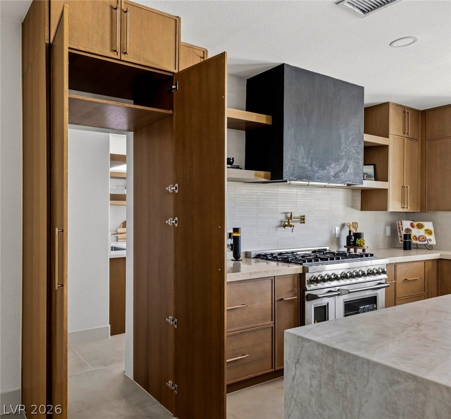Discreetly Concealed Doors Leads to A Fully Appointed Chef's Kitchen