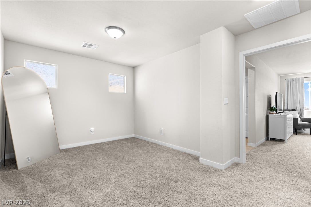An open and flexible bonus space features plush carpeting and high, clean ceilings.