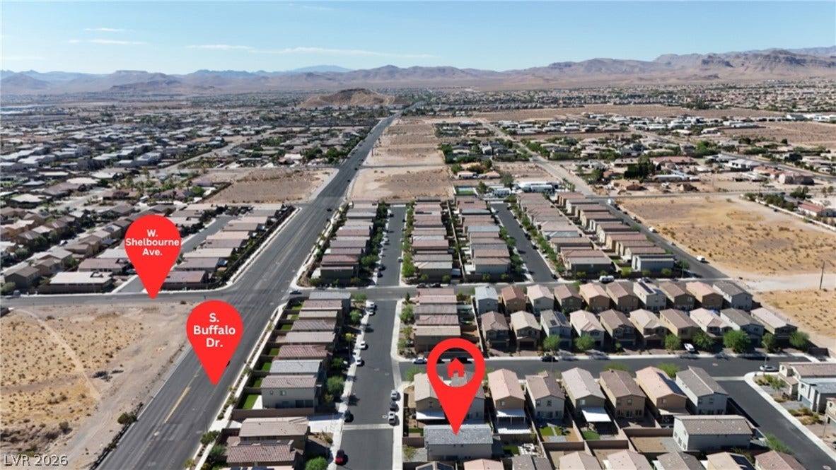 An aerial perspective showcases the neighborhood layout nestled against a desert mountain backdrop.