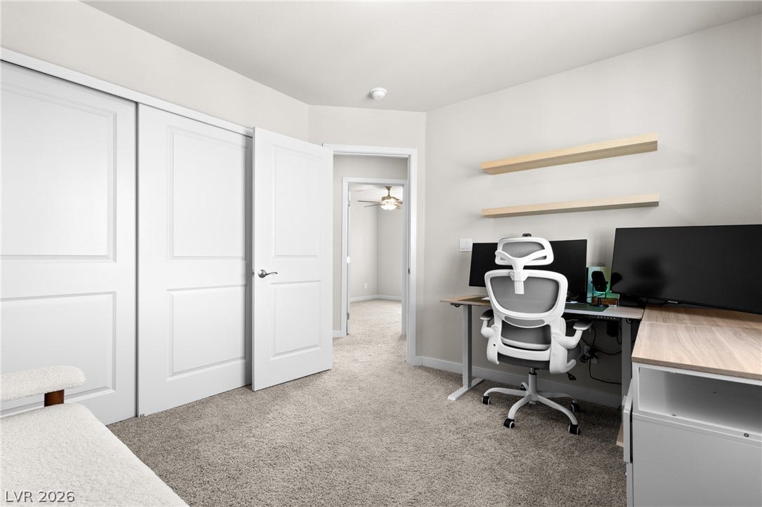 Smooth carpeting and sliding closet doors define this versatile secondary room.