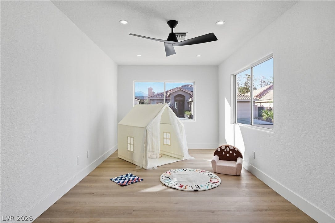 1612 Hidden Spring Drive, Las Vegas, NV 89117 Recessed lighting and warm wood flooring enhance this versatile interior space.