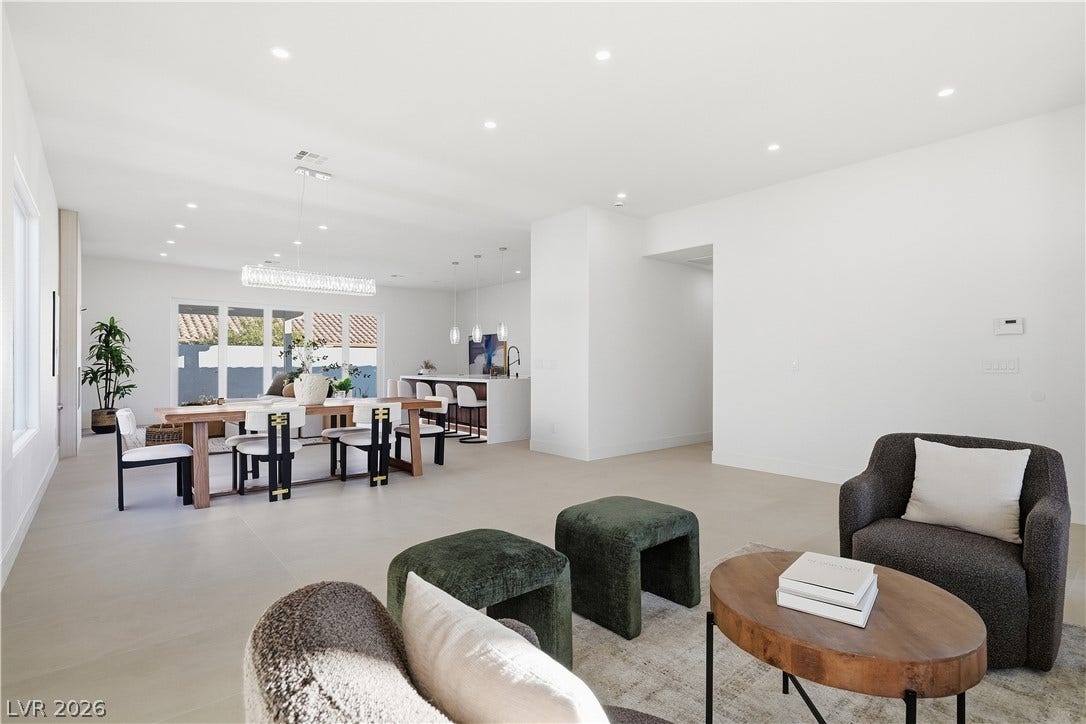 1612 Hidden Spring Drive, Las Vegas, NV 89117 Smooth tiled flooring and recessed lighting define this modern, open-concept living space.