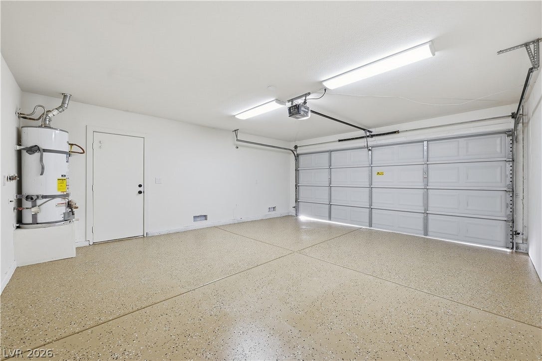 1612 Hidden Spring Drive, Las Vegas, NV 89117 Seamless epoxy flooring and a clean interior define this highly functional garage space.