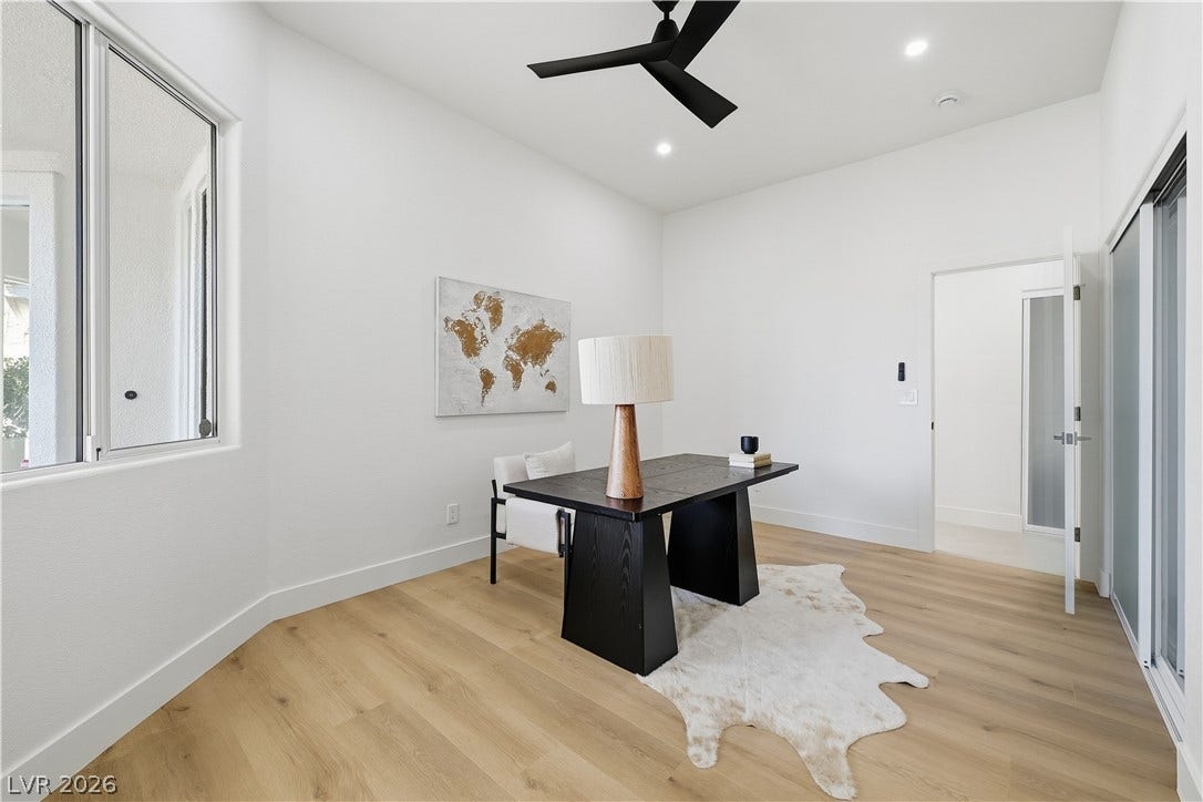 1612 Hidden Spring Drive, Las Vegas, NV 89117 Gleaming hardwood floors and a lofty ceiling define this quiet home office space.