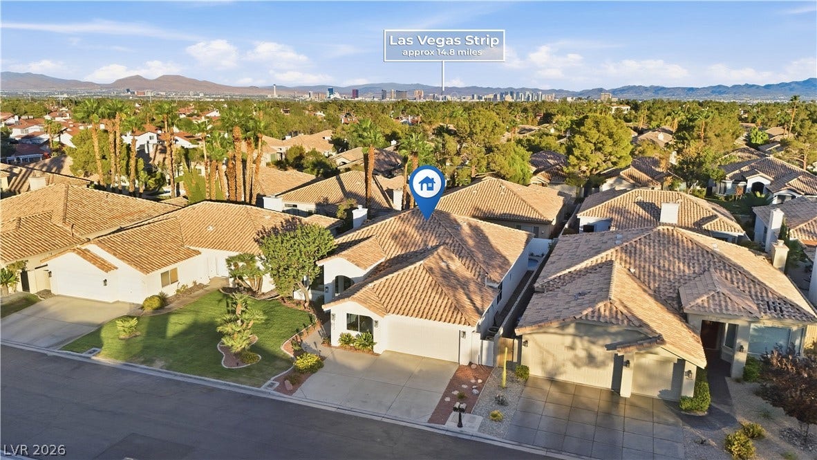 1612 Hidden Spring Drive, Las Vegas, NV 89117 Distant skyline vistas frame this quiet residential neighborhood with classic tile roofs.