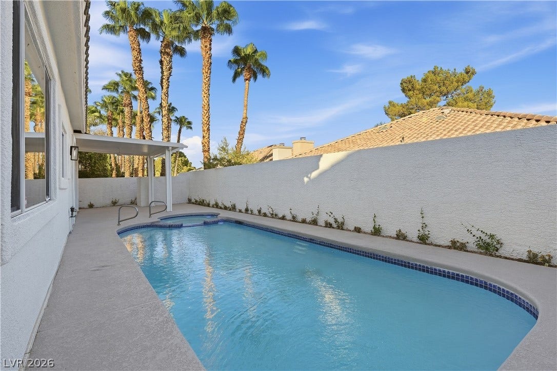 1612 Hidden Spring Drive, Las Vegas, NV 89117 An inviting swimming pool and spa are enclosed by a private privacy wall.