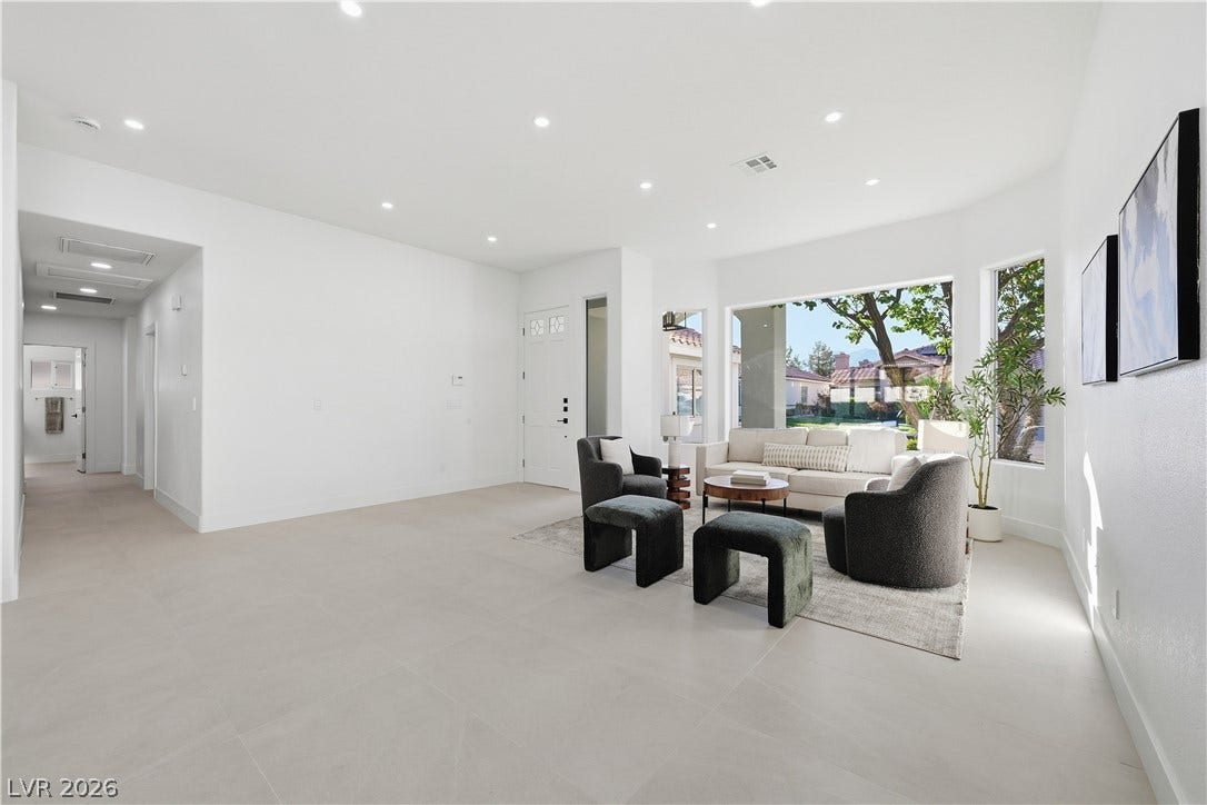 1612 Hidden Spring Drive, Las Vegas, NV 89117 Recessed lighting and oversized tile floors enhance this open, sunlit living area.