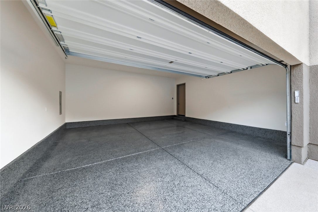 30 Sand Star Lane, Henderson, NV 89011 Coated concrete floors and smooth finished walls define this clean multi-car garage space.