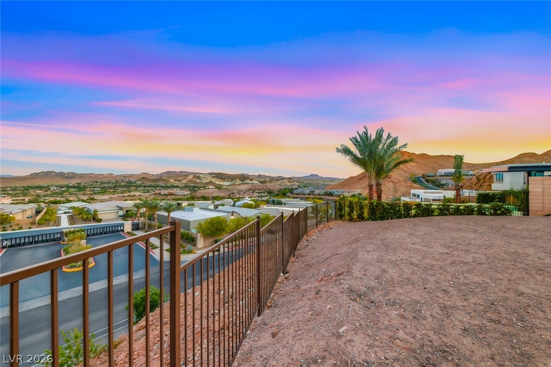 30 Sand Star Lane, Henderson, NV 89011 Panoramic mountain and neighborhood views unfold from this elevated, fenced backyard property edge.