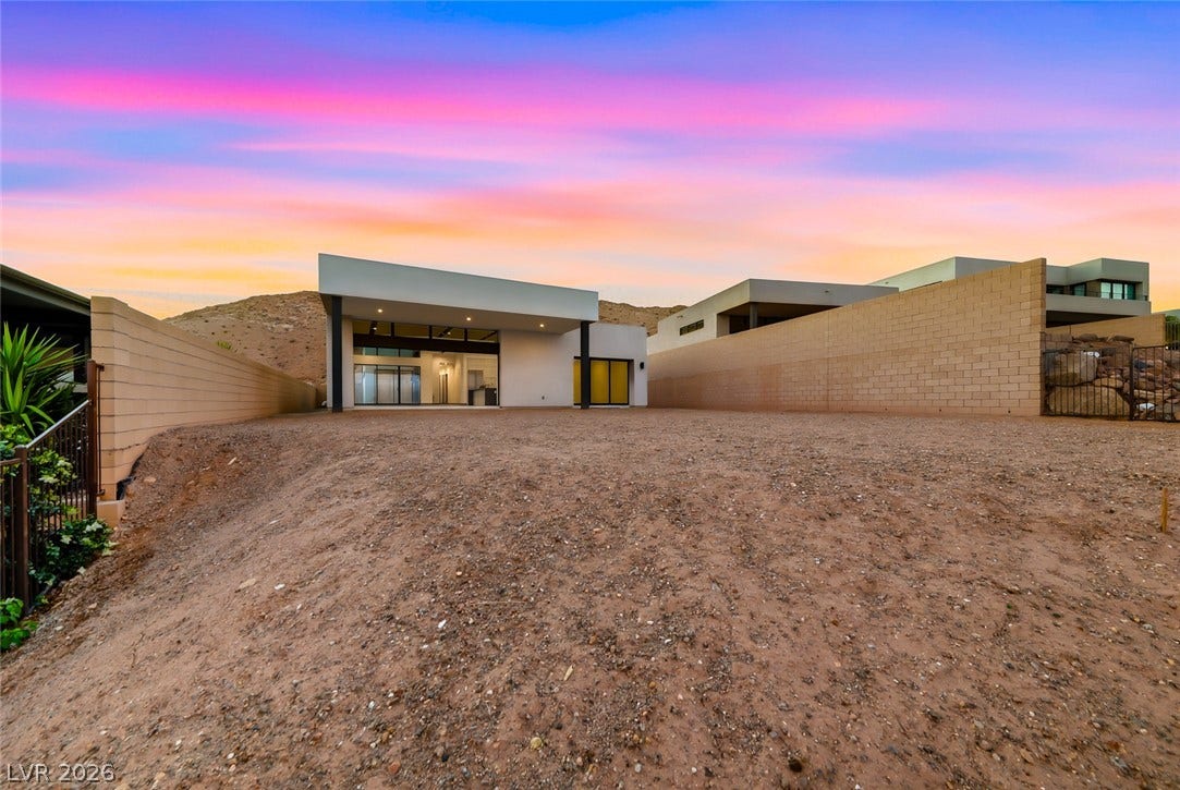 30 Sand Star Lane, Henderson, NV 89011 Clean lines and a spacious dirt yard define this modern desert exterior.