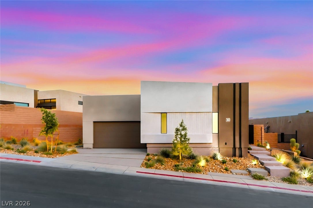 30 Sand Star Lane, Henderson, NV 89011 Striking contemporary architecture defines this modern desert home under a vibrant twilight sky.