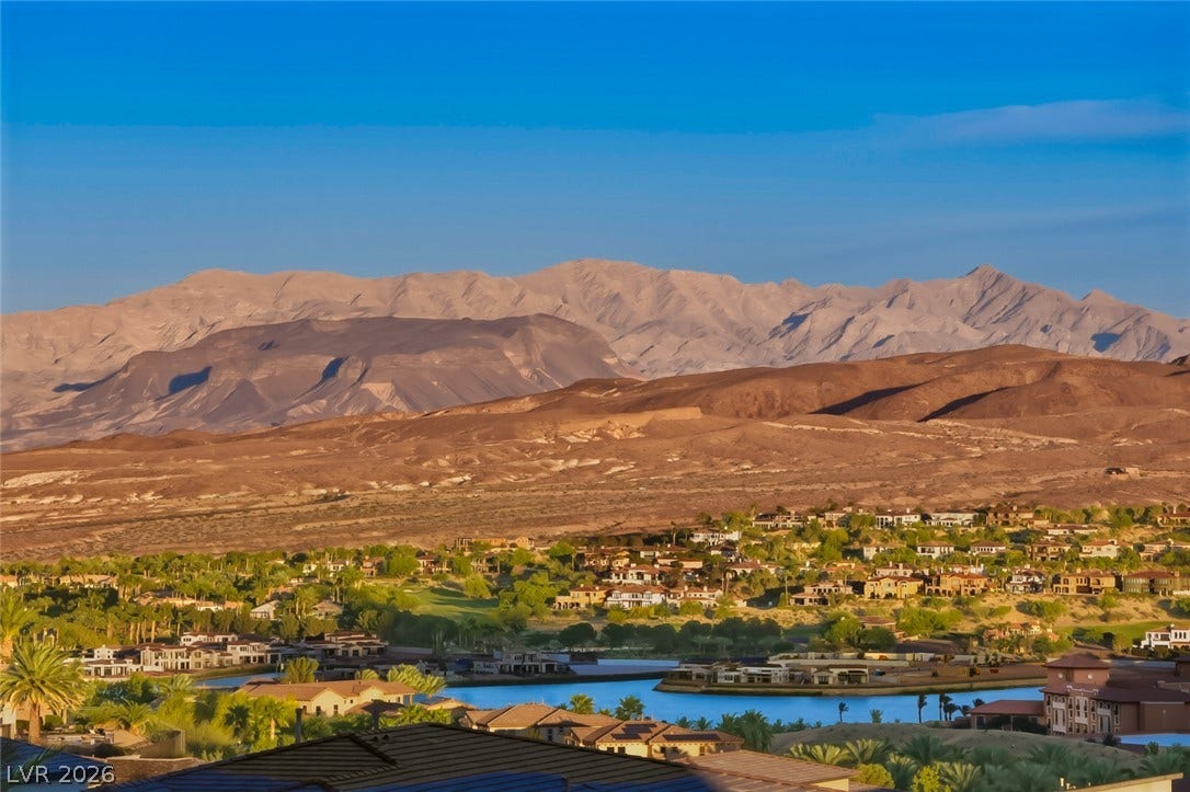 30 Sand Star Lane, Henderson, NV 89011 Dramatic mountain ranges rise majestically above a quiet valley community.