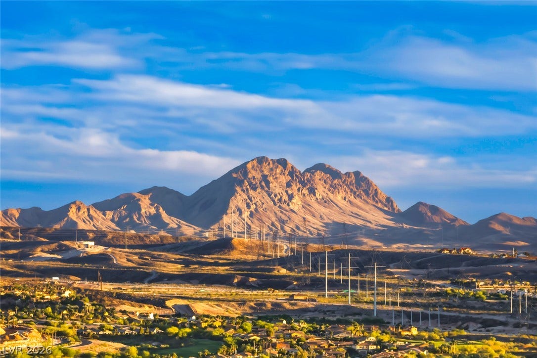 30 Sand Star Lane, Henderson, NV 89011 Dramatic mountain ridges rise above the desert valley floor under a vast sky.