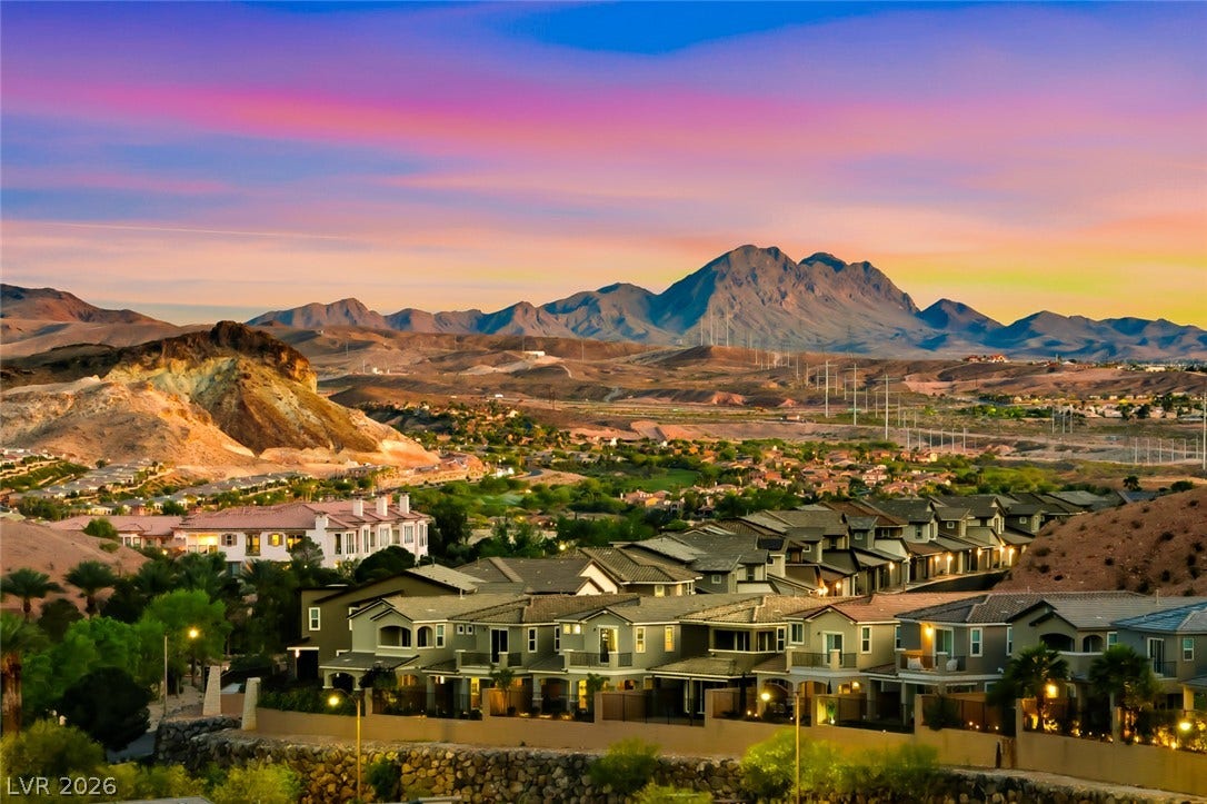 30 Sand Star Lane, Henderson, NV 89011 Dramatic mountain vistas rise above the peaceful desert neighborhood at sunset.