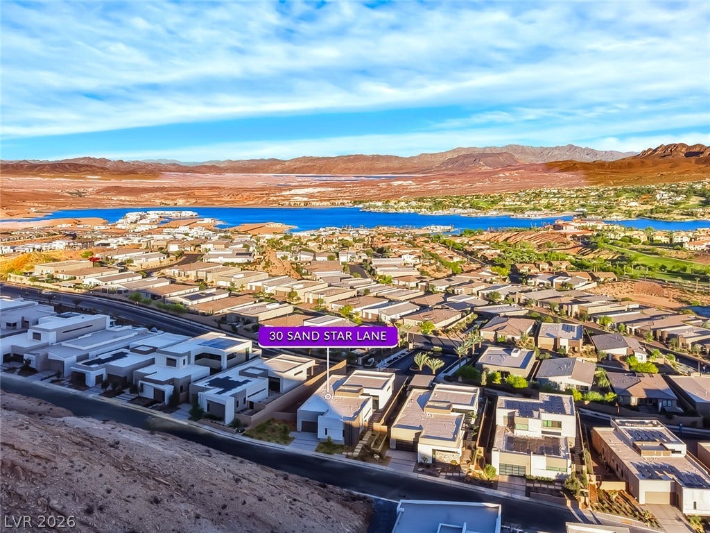 30 Sand Star Lane, Henderson, NV 89011 An aerial perspective showcases the neighborhood layout with backdrop water and mountain views.