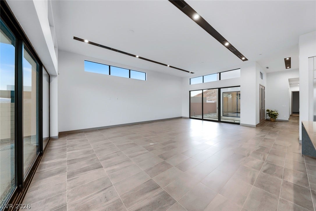 30 Sand Star Lane, Henderson, NV 89011 Clean lines and expansive tile floors define this modern, sunlit living area.