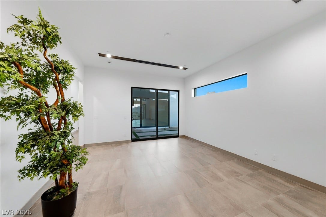 30 Sand Star Lane, Henderson, NV 89011 Clean lines and sleek tile floors define this modern, minimalist living space.