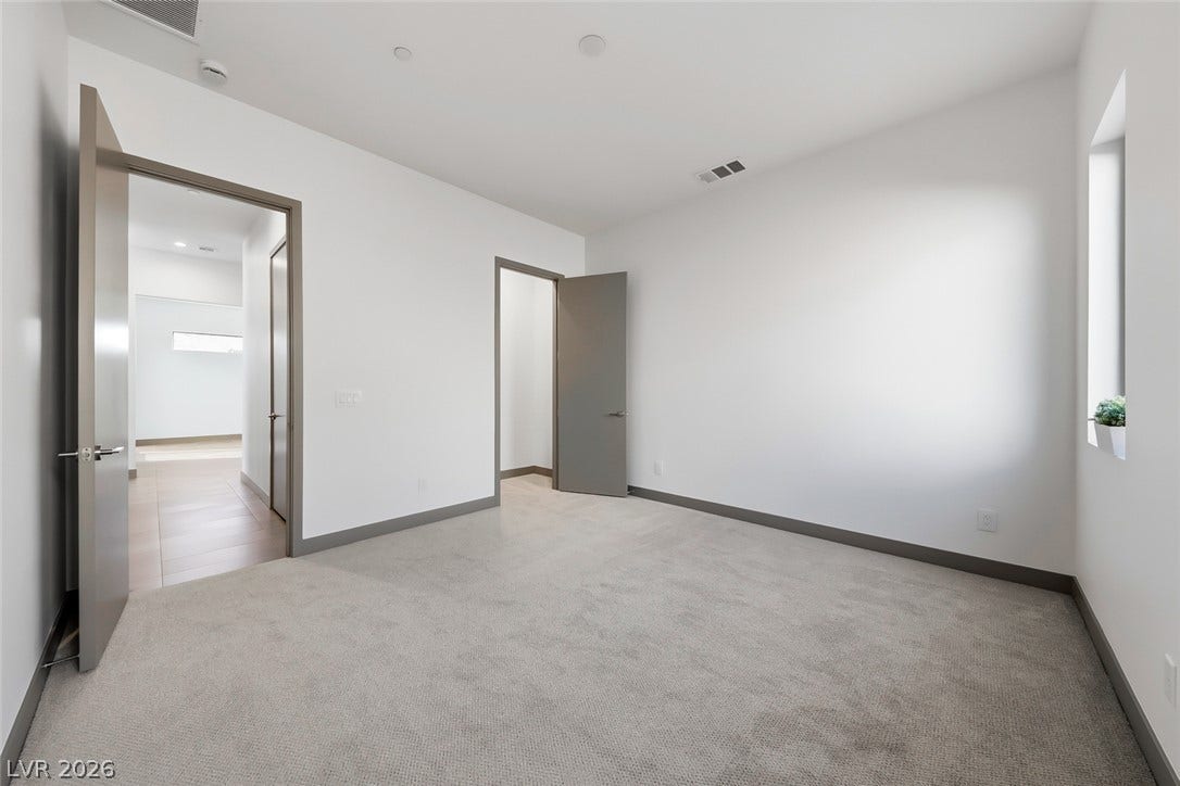 30 Sand Star Lane, Henderson, NV 89011 Clean lines and plush carpeting define this versatile space with recessed lighting.