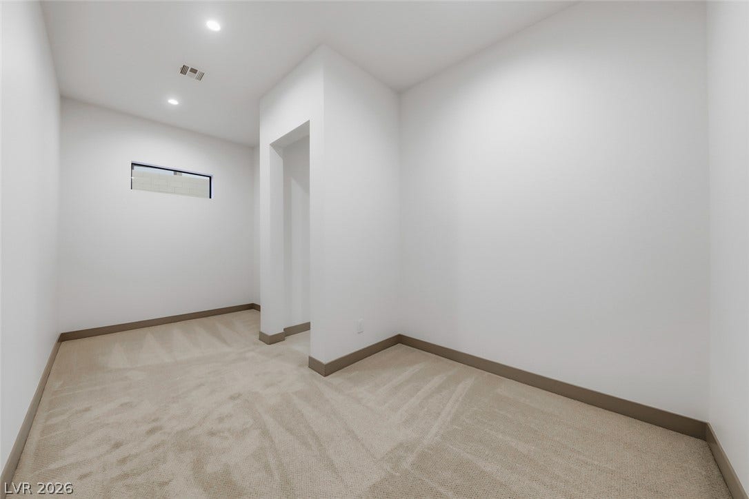 30 Sand Star Lane, Henderson, NV 89011 Plush carpeting underfoot and crisp white walls define this versatile interior bonus space.
