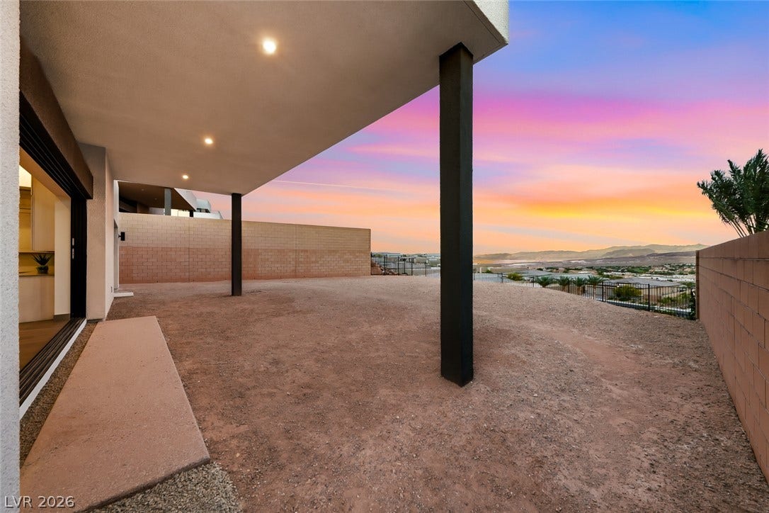 30 Sand Star Lane, Henderson, NV 89011 An expansive covered patio overlooks a scenic desert valley and distant mountain ranges.