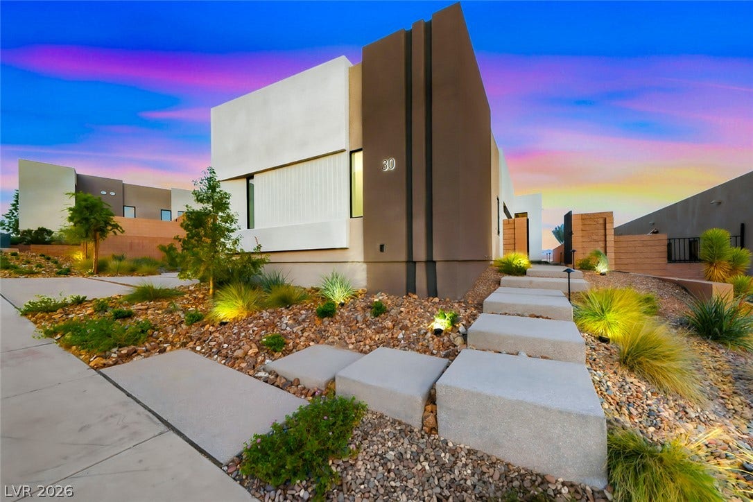 30 Sand Star Lane, Henderson, NV 89011 Striking contemporary architecture defines this modern residence situated amidst curated desert landscaping.