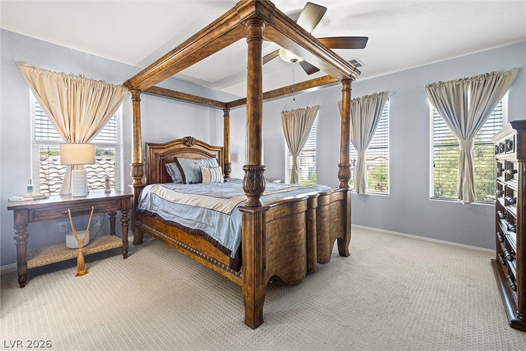 8944 Red Tapestry Court, Las Vegas, NV 89149 Plentiful windows invite natural light into this relaxing large primary bedroom.