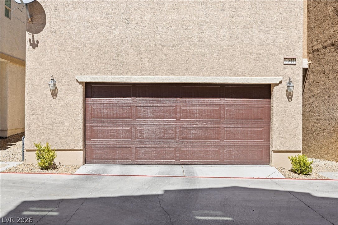 8944 Red Tapestry Court, Las Vegas, NV 89149 A spacious two-car garage features a durable stucco exterior, epoxy floor and entrance into the den.
