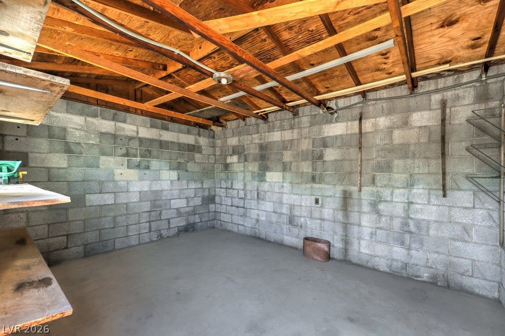 580 Karen Way, Henderson, NV 89015 Exposed wood rafters meet concrete block walls in this versatile utility space.
