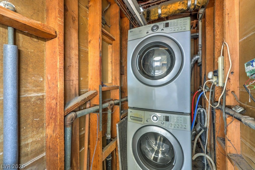 580 Karen Way, Henderson, NV 89015 Stacked laundry appliances fit efficiently within a rustic, unfinished utility space.