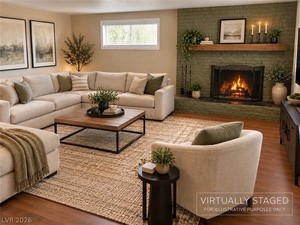 580 Karen Way, Henderson, NV 89015 Virtual Staged Photo. A painted brick fireplace creates a striking focal point alongside rich hardwood flooring.