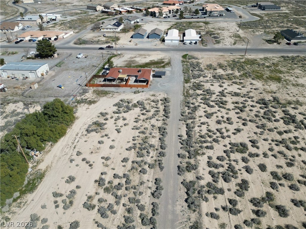 A long private driveway leads to this secluded desert property surrounded by natural terrain.