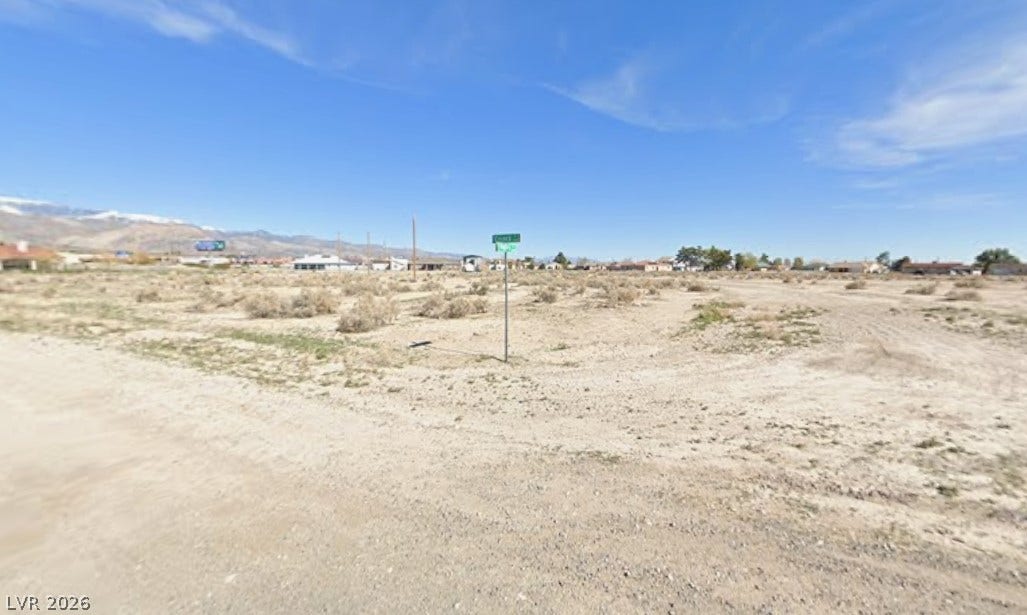 2321 S Council Court, Pahrump, NV 89048 An open desert lot offers a vast canvas framed by distant mountain peaks.