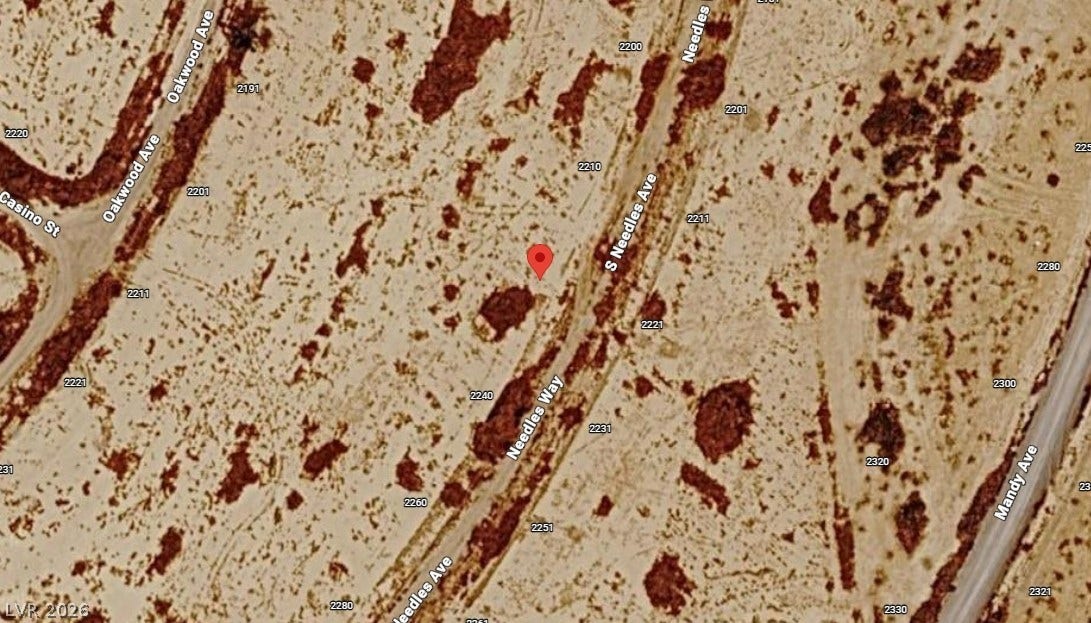 Satellite perspective shows the lot location marked clearly within the surrounding neighborhood roads.