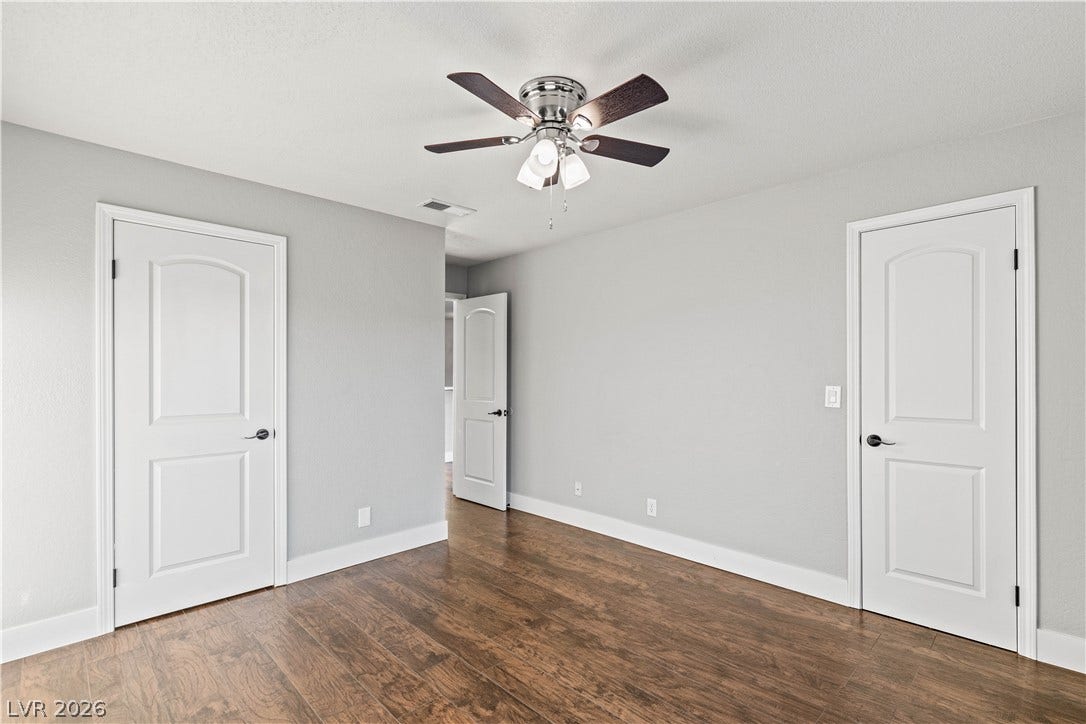 Gleaming hardwood floors and classic paneled doors define this versatile interior space.