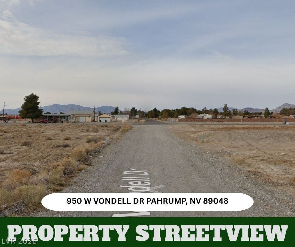 950 Vondell Drive, Pahrump, NV 89048 A gravel access road leads toward distant mountain silhouettes under an open desert sky.