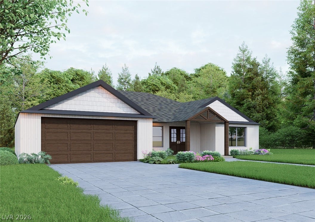 950 Vondell Drive, Pahrump, NV 89048 Clean lines and a spacious driveway define this modern single-story residence nestled among mature trees.