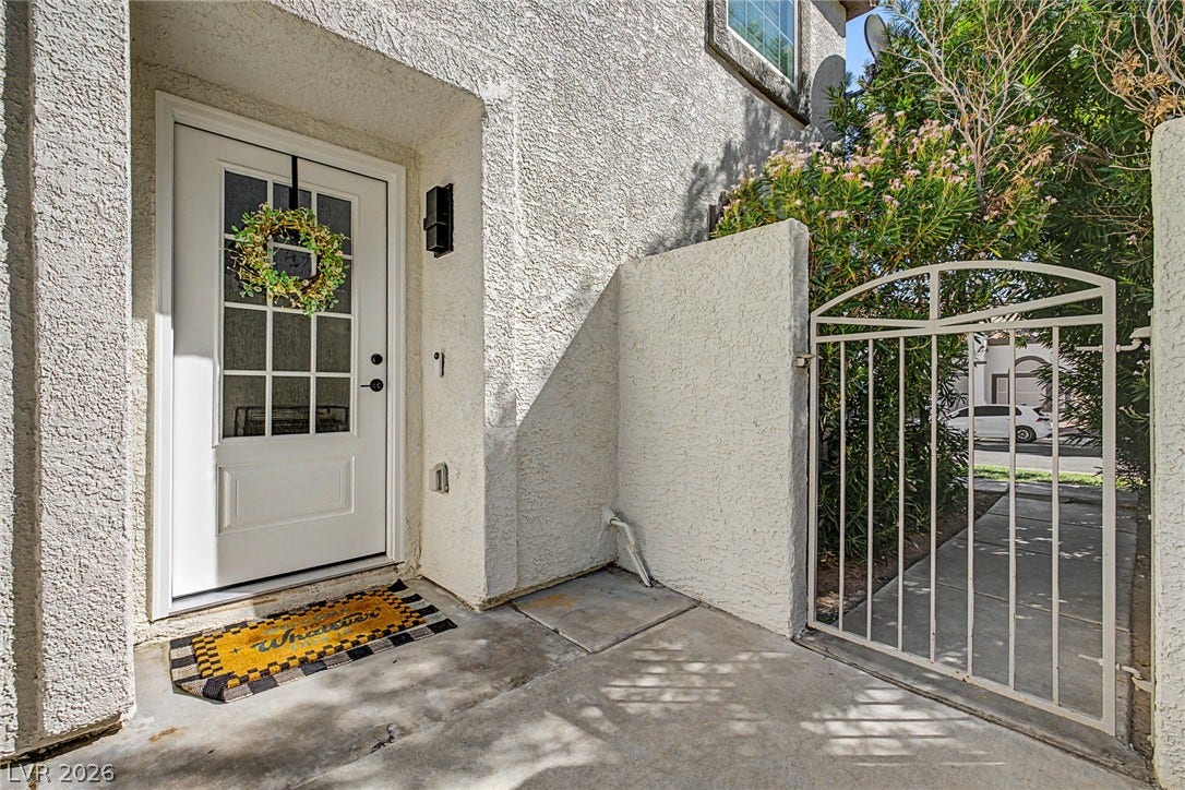 199 Winnsboro Street, Henderson, NV 89074 A gated entry path leads directly to the stucco entryway.