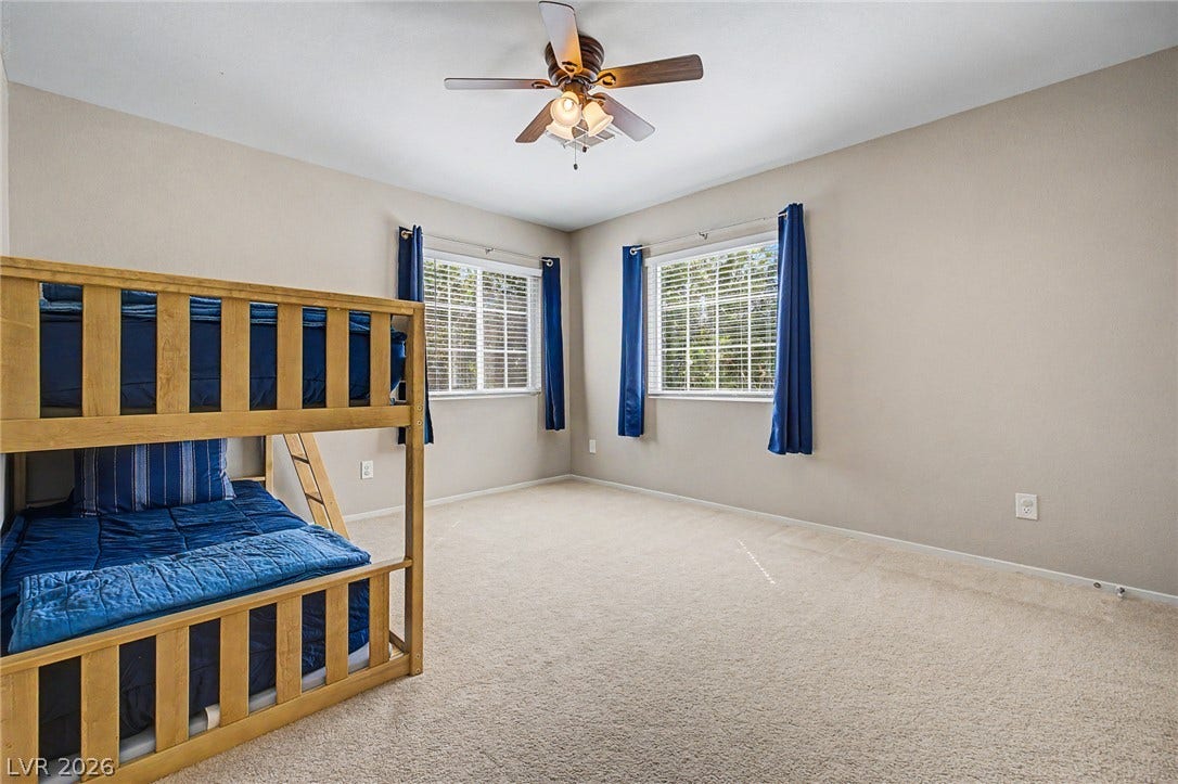 199 Winnsboro Street, Henderson, NV 89074 Plentiful natural light streams through dual windows onto plush carpeting.
