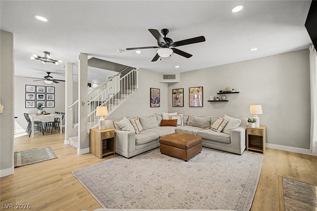 199 Winnsboro Street, Henderson, NV 89074 Gleaming hardwood floors and a modern staircase define this welcoming, open living space.