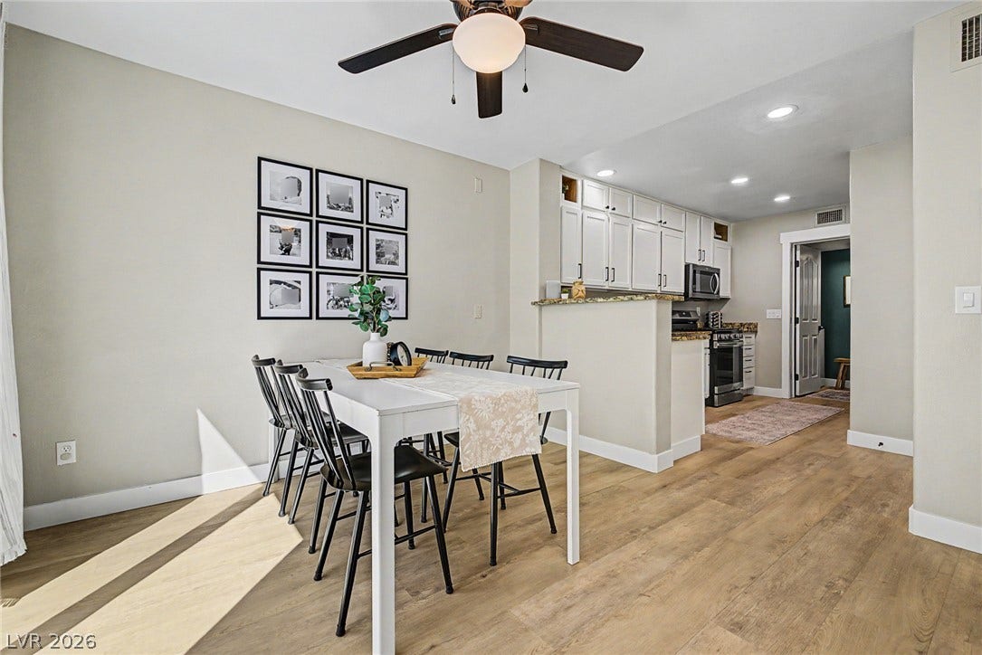 199 Winnsboro Street, Henderson, NV 89074 Warm wood floors and recessed lighting enhance this versatile open-concept dining area.