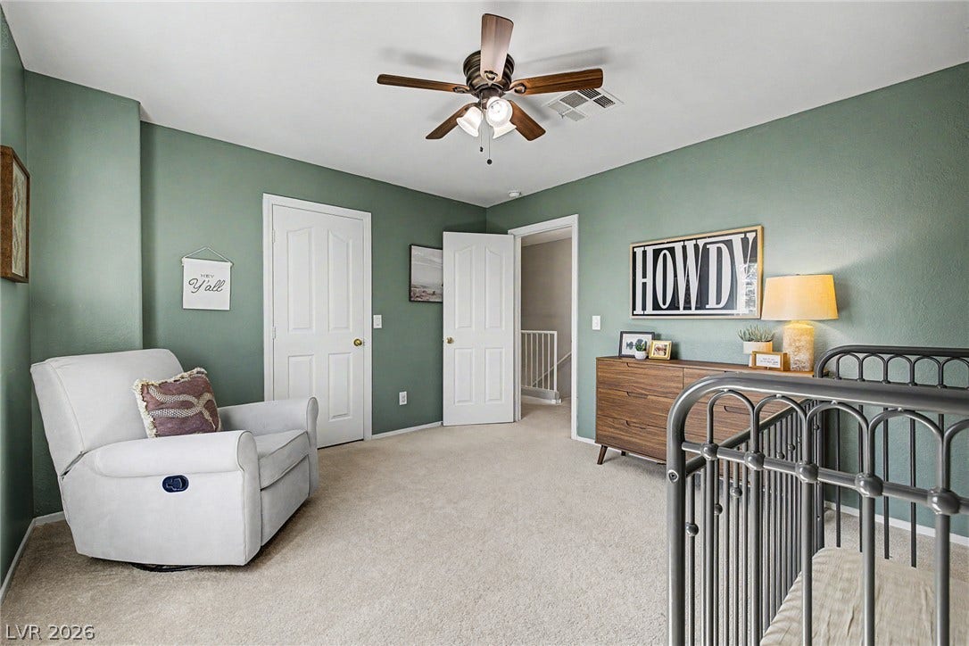 199 Winnsboro Street, Henderson, NV 89074 Plush wall-to-wall carpeting and clean trim-work anchor this versatile secondary bedroom space.