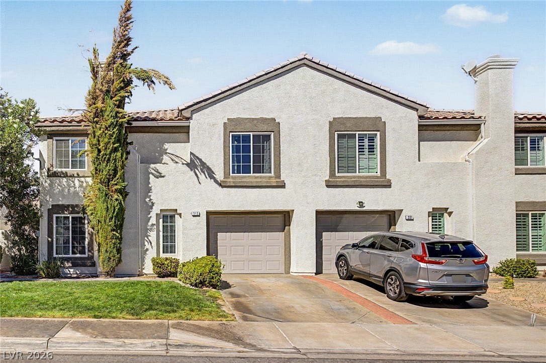 199 Winnsboro Street, Henderson, NV 89074 A classic stucco exterior frames the front of this multi-level residential townhouse.