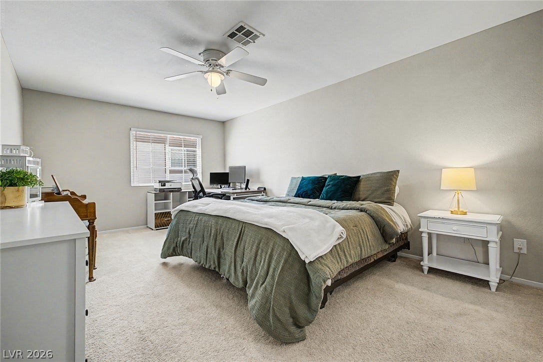 199 Winnsboro Street, Henderson, NV 89074 Plush wall-to-wall carpeting and clean neutral walls anchor this comfortable secondary bedroom.