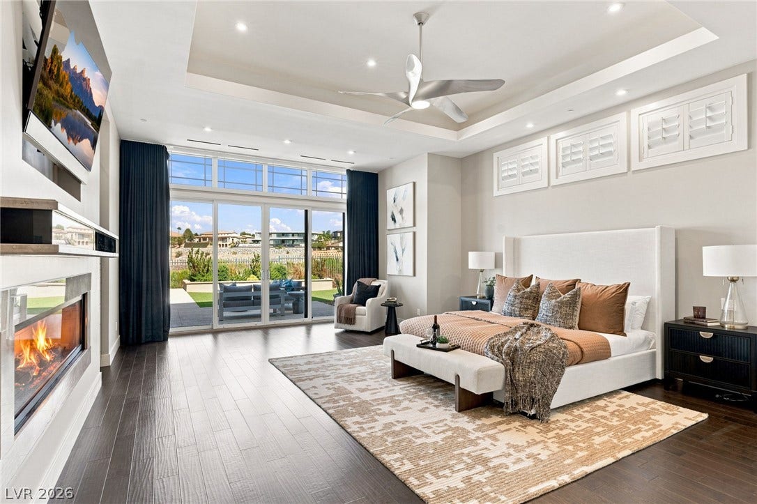 1376 Opal Valley Street, Henderson, NV 89052 Gleaming wood floors and a contemporary fireplace define this elegant modern retreat.