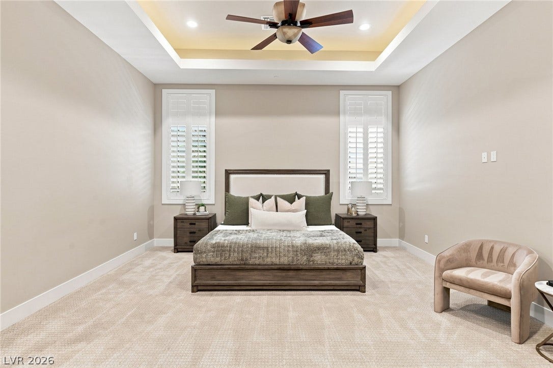 1376 Opal Valley Street, Henderson, NV 89052 Plush carpeting and an elegant tray ceiling define this peaceful bedroom retreat.