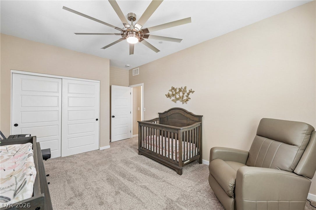 194 Viento Ridge Street, Henderson, NV 89012 Plush carpeting underfoot complements the neutral walls of this versatile secondary bedroom space.