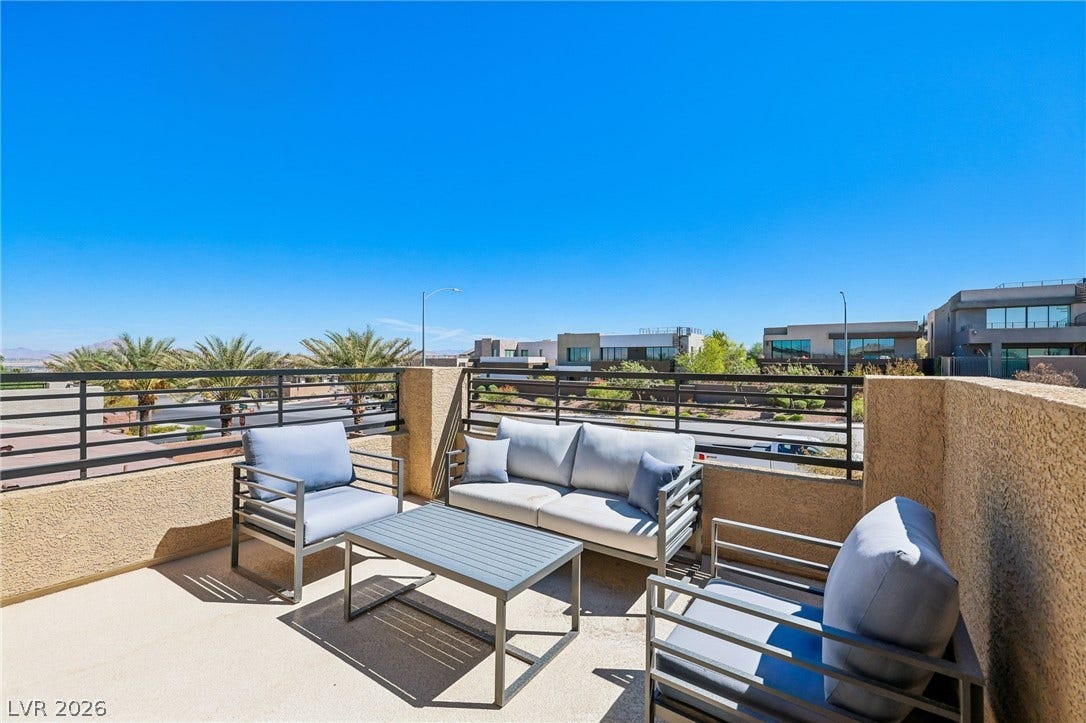 194 Viento Ridge Street, Henderson, NV 89012 An open balcony offers clean lines and distant mountain views under a clear blue sky.