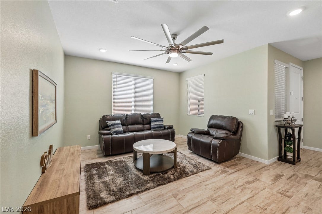 194 Viento Ridge Street, Henderson, NV 89012 Gleaming tile flooring and abundant recessed lighting enhance this welcoming living space.