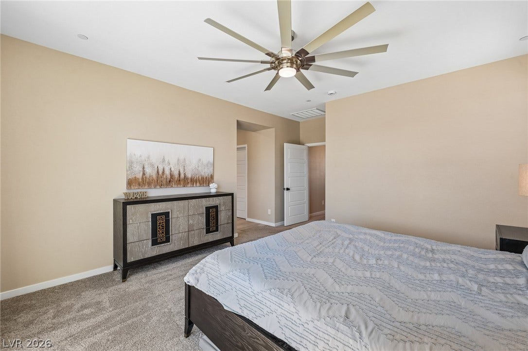 194 Viento Ridge Street, Henderson, NV 89012 Soft carpeting pairs with smooth neutral walls in this comfortable and quiet bedroom retreat.